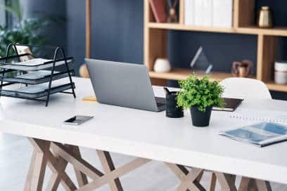 Modern office desk with laptop and equipment