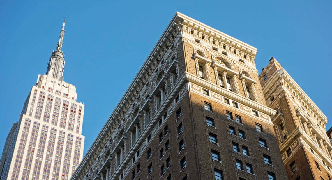 A close-up of the details of New York buildings, including brickwork, windows, and cornices.